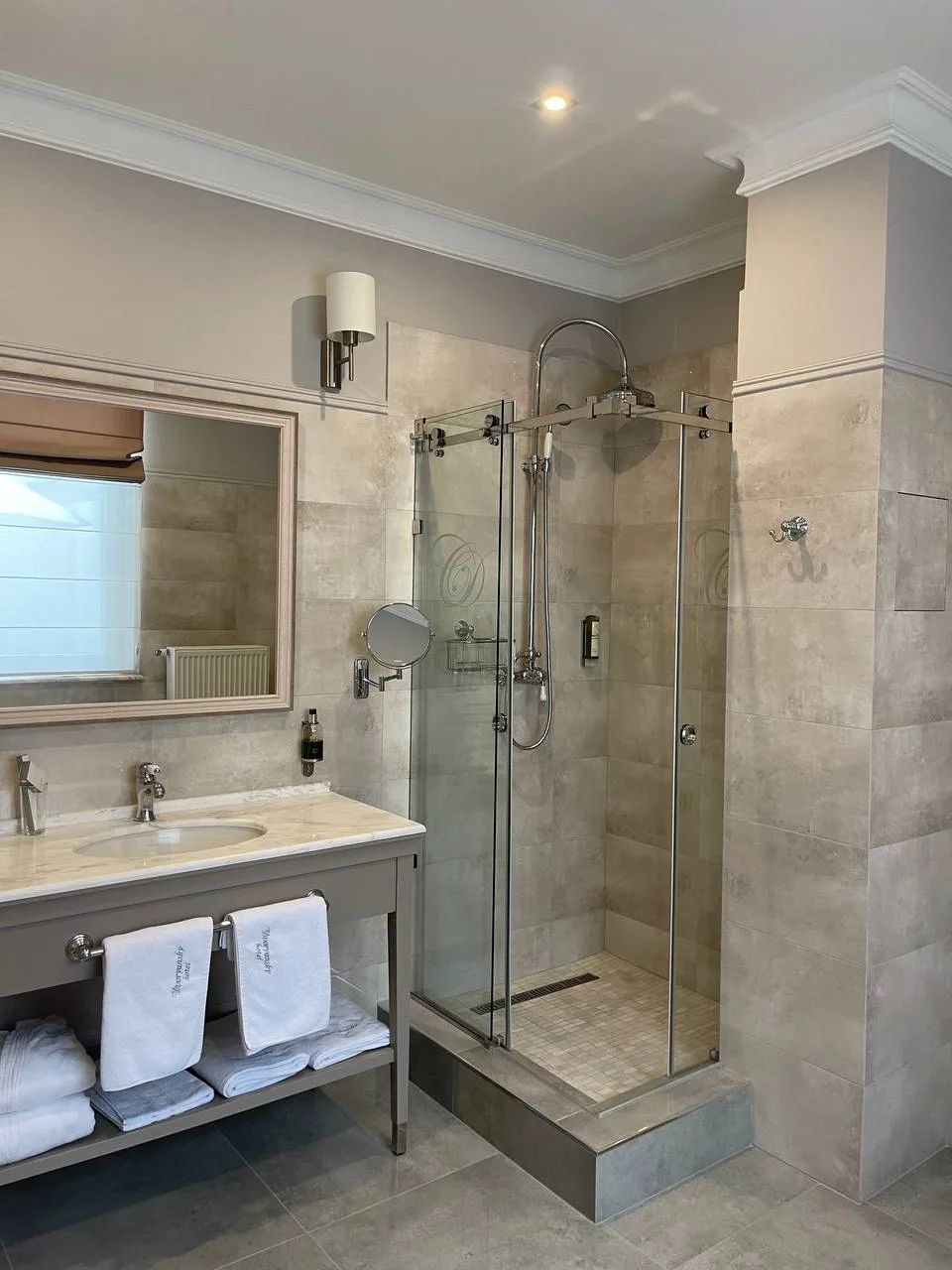 Hotel bathroom with a glass shower enclosure