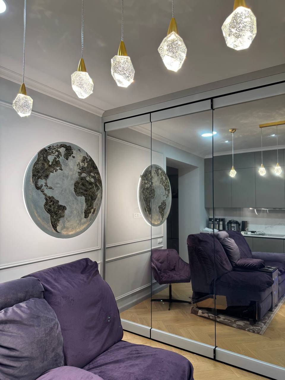 Folding glass partition with mirror film reflecting a living room