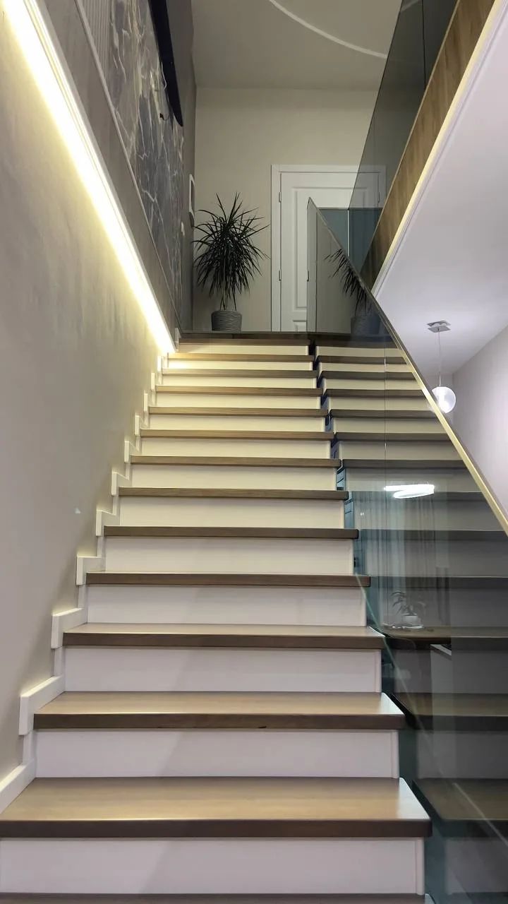Staircase in a private house with a glass railing